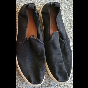 Toms black canvas slip ons